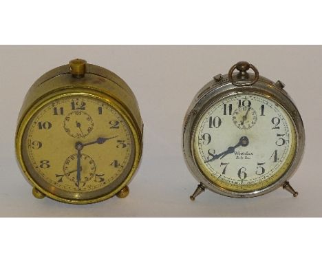 A Zenith brass alarm clock, the brass coloured face with Arabic numerals and seconds and hour subsidiary dials, 8cm high x 8c