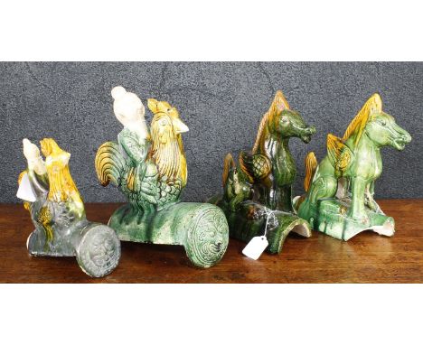 Chinese sancai glaze roof tile modelled as a man riding a rooster, 11.5" high; together with a similar smaller tile, 9" high;