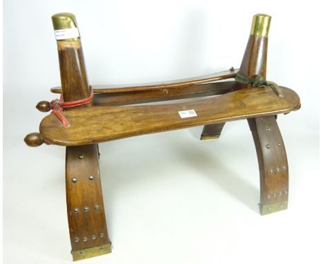 Eastern hardwood camel saddle stool, H48cm    Condition Report   Click here for further images, condition, auction times & de
