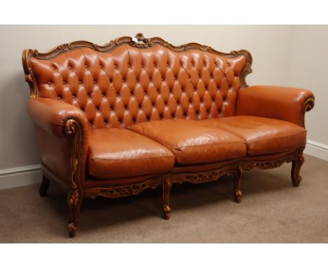 Italian carved walnut framed three piece lounge suite upholstered in tan leather - three seat sofa and pair matching armchair