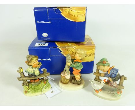 Three Goebel Hummel figures with animals, two boxed (3)   Condition Report   Click here for further images, condition, auctio