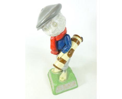 Dunlop Caddie figure carrying a golf bag with three clubs, inscribed “We play Dunlop" to the base, H38.5cm    Condition Repor