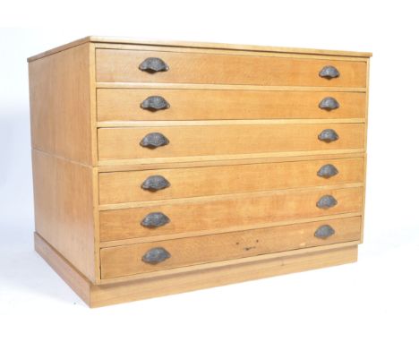 A mid 20th Century retro vintage light oak plan chest / architect drawers comprising of two sections each having three drawer