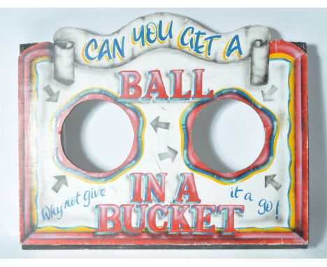 An original vintage 20th century fairground / circus ' Ball In A Bucket ' game hand painted board. The board featuring hand p