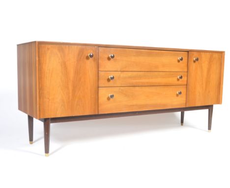 G Plan / E. Gomme - A mid 20th Century retro vintage walnut sideboard credenza having a central bank of three graduating draw