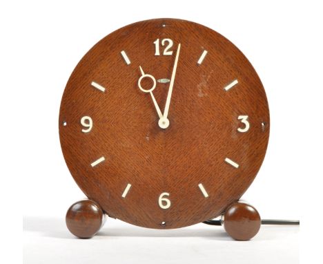 Metamec - an original vintage 1940's oak mantel clock by Metamec. Circular face, the clock supported by circular feet. The di