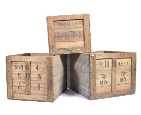 A set of three original vintage open topped wooden shipping crates of graduating sizes, each having shipping stamps to the si
