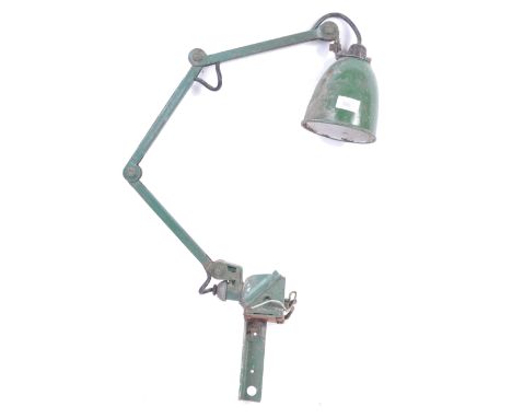 An original 1950's retro vintage industrial factory work desk lamp light having a green enamel pendant shade set to an opposa