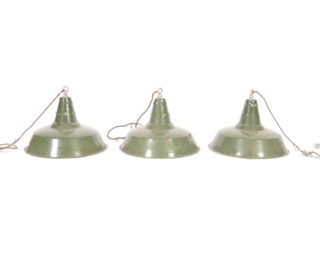 A set of three 20th Century retro vintage industrial porcelain enamel pendant lights having galvanized hanging hooks atop. Th