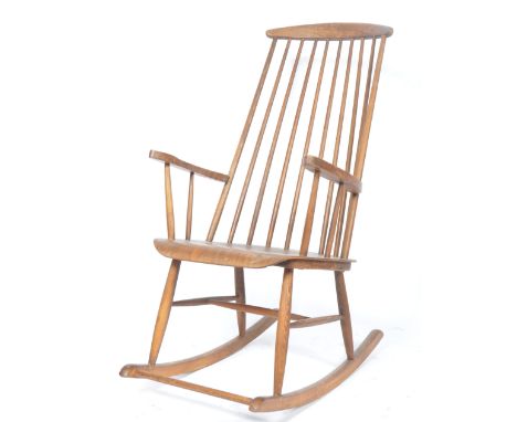 Ilmari Tapiovaara - An original 1950's Finish retro vintage beech wood rocking chair having a curved back rail with spindle b