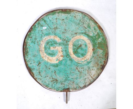 An original retro vintage 20th century ' Stop / Go ' metal roadside industrial sign. Usual circular form, with red and green 