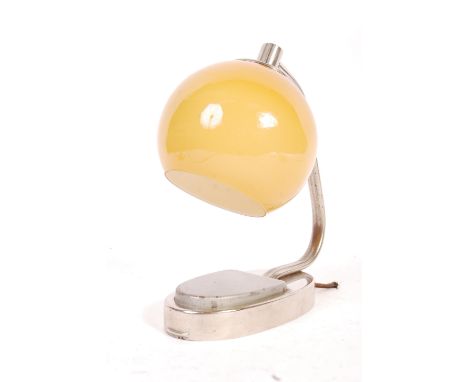 A mid 20th Century retro vintage Art Deco style chrome wall / table lamp having a glass golden amber globe light shade suppor