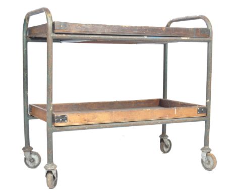 A mid 20th Century vintage industrial two tier trolley cart having a tubular steel construction with wooden walled trays, all