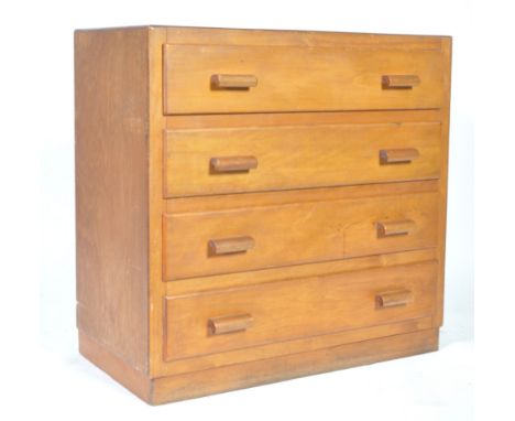 A mid 20th Century retro vintage utility light oak chest of drawers having a bank of four straight drawers each with two lipp