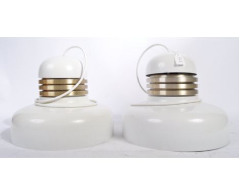 A pair of original 1960's German retro vintage ceiling light lamps of UFO shape with white enamel coated finish and silvered 
