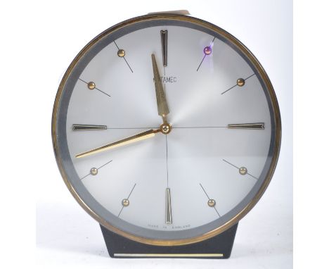 Metamec - A 20th Century retro vintage Art Deco style desk clock of circular form having a silvered dial with gilded batton n