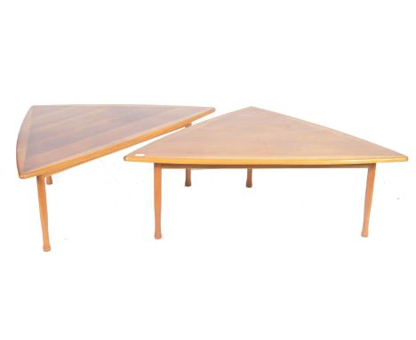 A pair of original Danish 1960's retro vintage teak wood coffee / side occasional tables of triangular shape raised on shaped