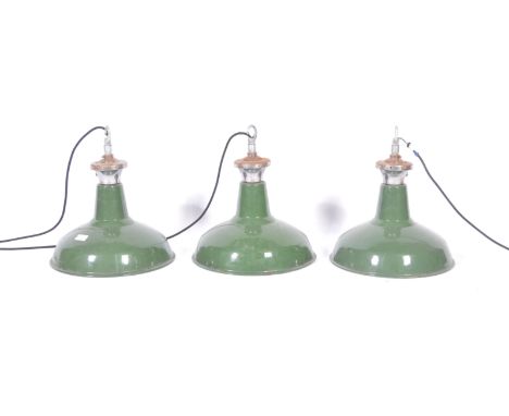 A set of three 20th Century retro vintage industrial porcelain enamel pendant lights having chromed junction boxes and galvan