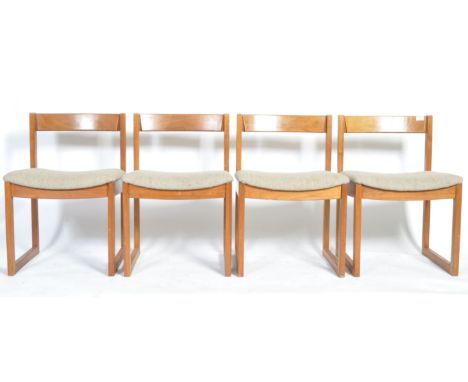 A set of four 20th Century Danish retro vintage teak wood dining chairs having shaped edge backrests, padded woolen upholster