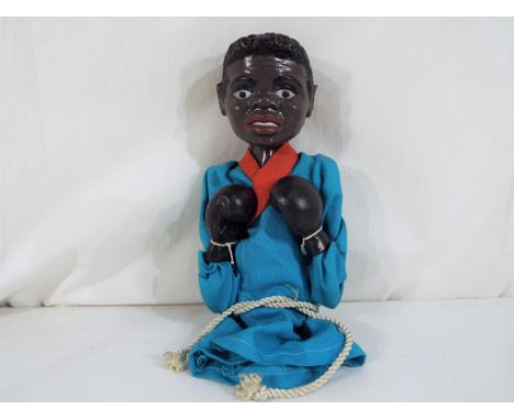 A mechanical glove puppet in the style of a boxer, 25 cm (high) - This lot MUST be paid for and collected, or delivery arrang