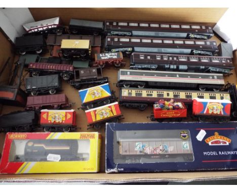 Hornby / Bachmann / Wrenn - a quantity of good OO gauge rolling stock comprising five passenger carriages and 21 goods wagons
