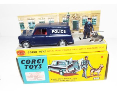 Corgi Toys - a diecast scale model of a BMC Mini Police Van with Tracker Dog and Handler, dark blue with red interior, with d