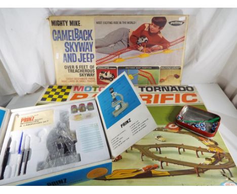 A mixed lot comprising a boxed Motorific Tornado Racerific remote control racing cars with track (boxed), Mighty Mike by Pali