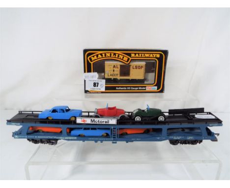 Model Railways - a Lima British Rail motor rail rolling stock carriage with cars and a mainline railways OO gauge Palitoy Ven