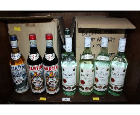 A collection of 15 bottles of Bacardi Superior Light Dry Rum (6), Martini Extra dry (3), Martini Rosso (3) and Martini Bianco