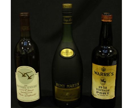 A bottle of Warre's 1958 Vintage Port, late bottled 1961, label slightly stained, together with a bottle Remy Martin VSOP Cog