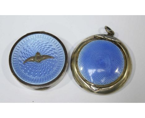 An RAF silver and enamel pill box, with applied enamel RAF crest, together with another silver and enamel pill box. (2)