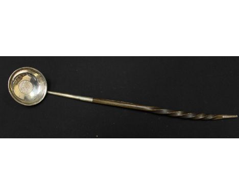 A Georgian silver and horn toddy ladle, the bowl inset with a George II 1758 coin, with twisted horn handle.