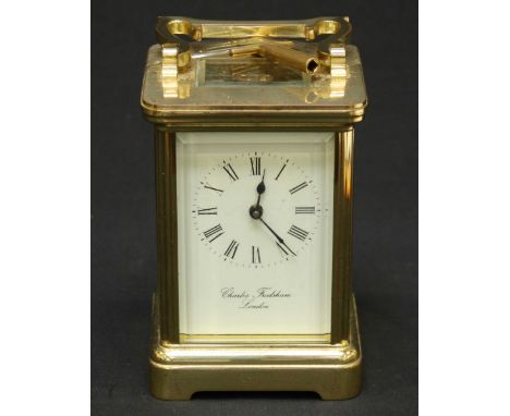 A contemporary Charles Frodsham brass timepiece carriage clock, the signed white enamel dial with black Roman numerals and se