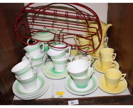 SECTION 24. A Crown Ducal yellow ground coffee service, together with an Art Deco Anchor china tea service and a matched Shel