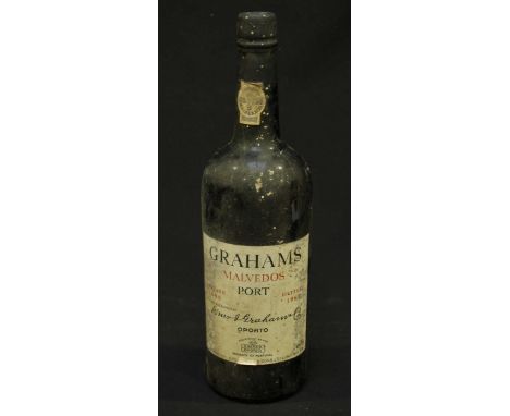 A bottle of 1965 Graham's Malvedos Vintage Port.