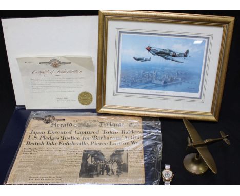 RAF interest. A brass model of a Spitfire, a quartz RAF commemorative wrist watch, a Limited Edition Roy Huxley 'Spitfire ove