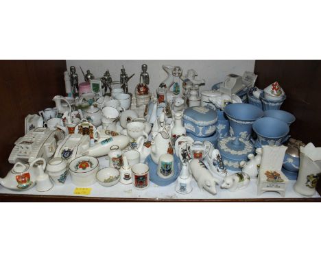 SECTION 5. A shelf of assorted crested china including Arcadian, Carlton china, and others, pieces include 2 WWI tanks, an ai