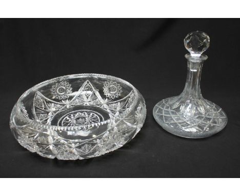 A glass ships decanter with stopper of globular form, together with a cut glass lamp of baluster form with globular shade and