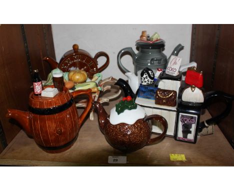 SECTION 29.  Seven assorted collectors ceramic teapots, one modelled as a Christmas pudding.