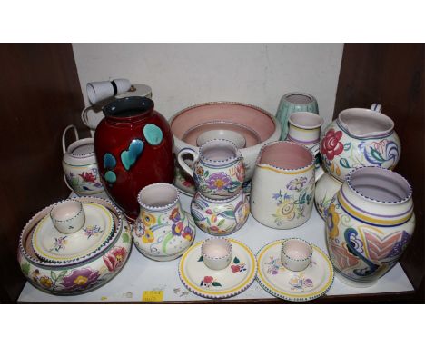 SECTION 7.  A good collection of Poole Pottery including vases, jugs, bowls, a table lamp four eggcups with integral stands e