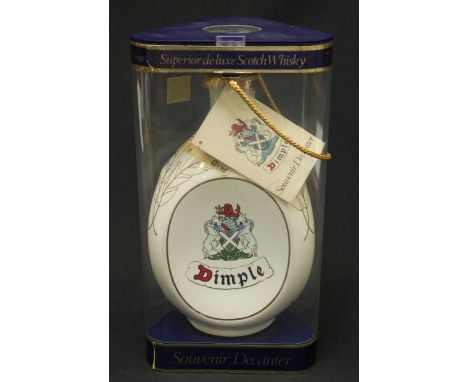 A bottle of Dimple De Luxe 12 year old Scotch Whisky, 75cl bottle, in original plastic triangular packaging.