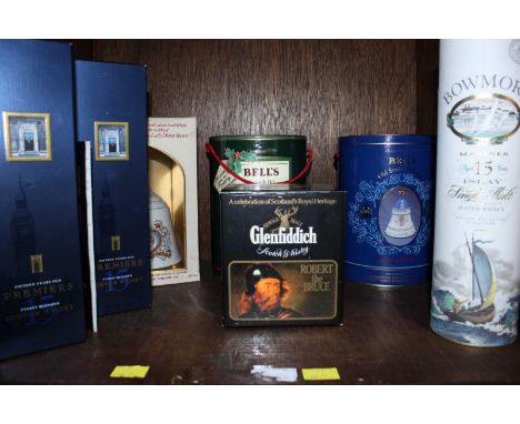 Three Bells whiskey decanters with contents, together with a bottle of Glenfiddich Robert the Bruce whisky, a bottle of Bowmo
