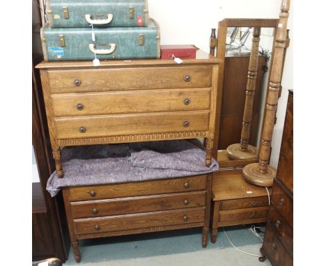 A pair of oak three drawer chests 74cm high x 107cm wide, a matching cheval mirror and an oak standard lamp (4) Condition Rep