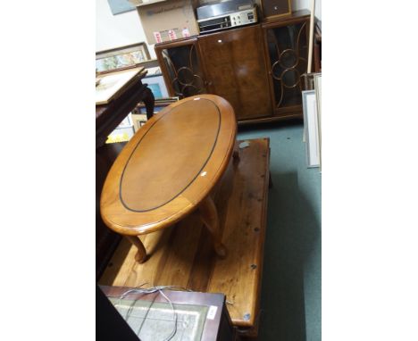 An  oval coffee table and a mahogany display cabinet (2) Condition Report: Available upon request