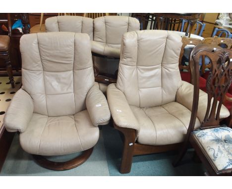 An Ekorness Stressless four piece leather suite comprising sofa, two chairs and a footstool (4) Condition Report: Available u
