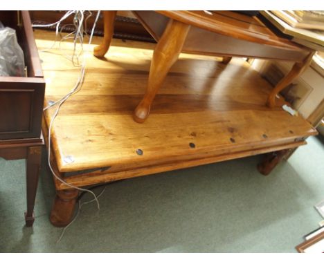 A hardwood coffee table Condition Report: Available upon request