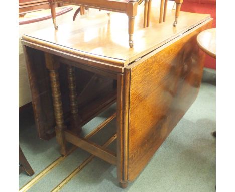 An oak drop leaf table Condition Report: Available upon request