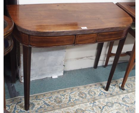 An inlaid mahogany fold over tea table Condition Report: Available upon request