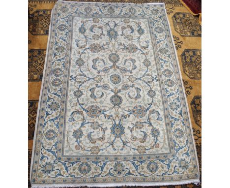 A light ground Keshan rug with allover floral design, 165cm x 115cm Condition Report: Available upon request
