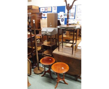 Two standard lamps, occasional tables and a typewriter Condition Report: Available upon request